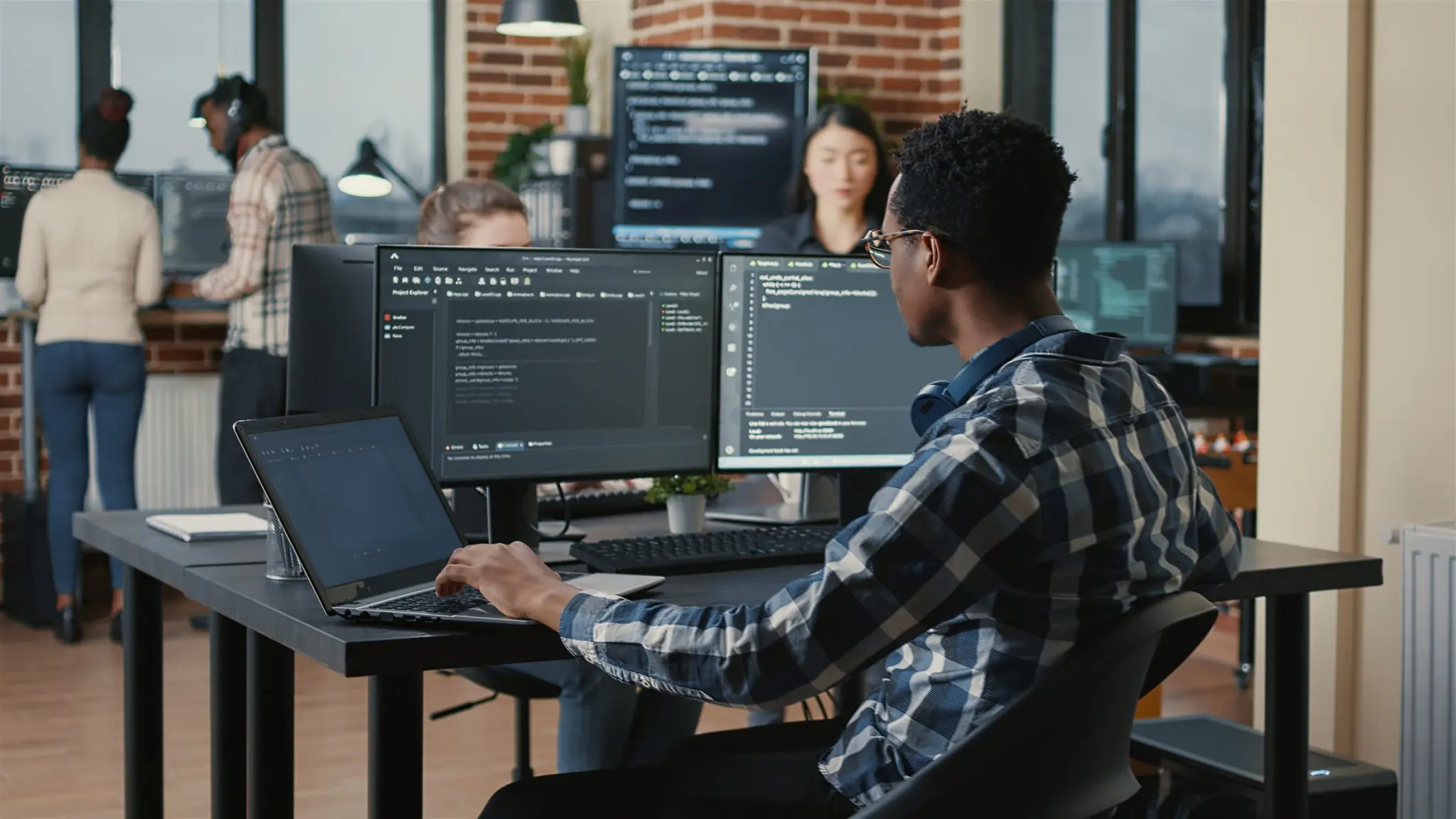 Engineers building software across multiple screens